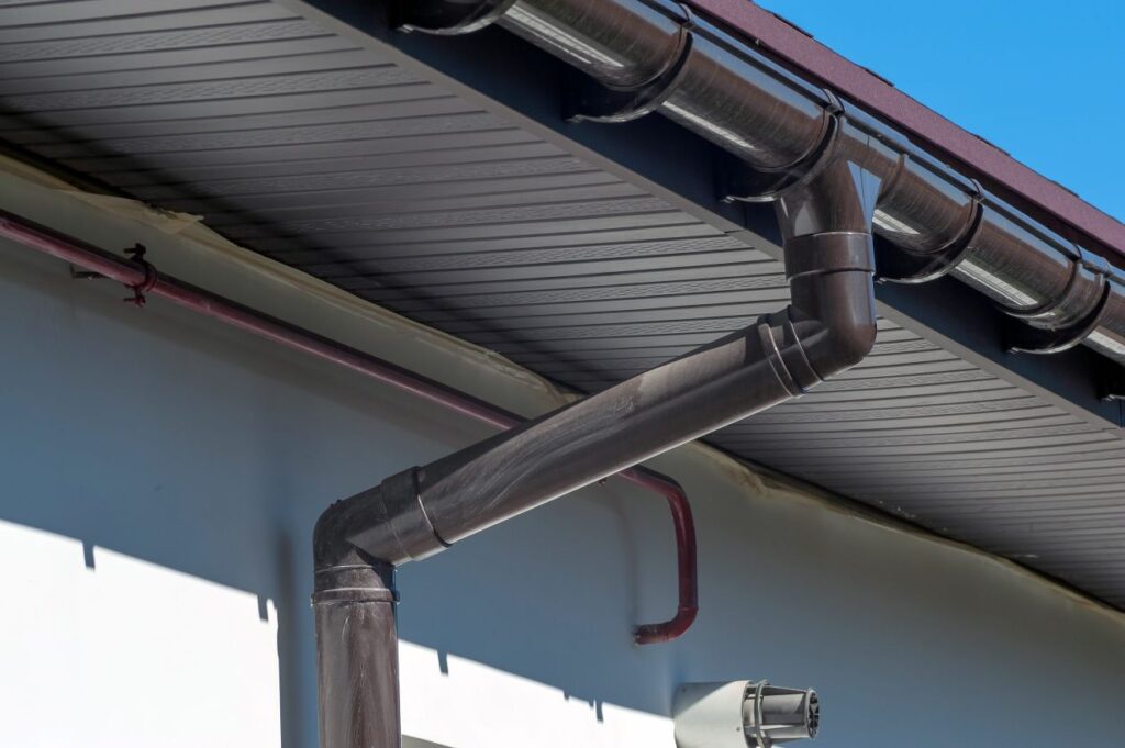 Gutter Installation in South Jordan, UT, Gutter Installation in Saratoga Springs - UT in progress as installers secure new gutters along a two-story roofline