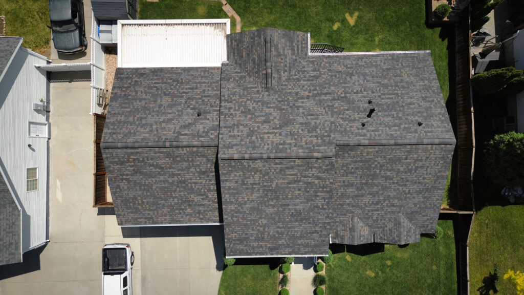 Roof Repair in Heber City - UT crew replacing damaged shingles beside a roof valley after a storm