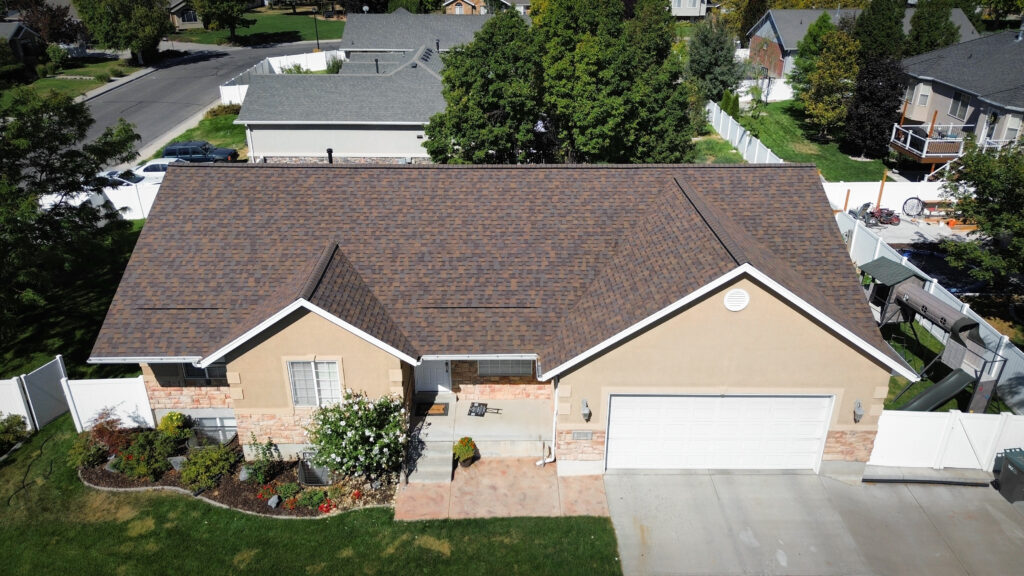 Roofing Contractor in Wasatch County - UT inspecting flashing on a steep residential roof