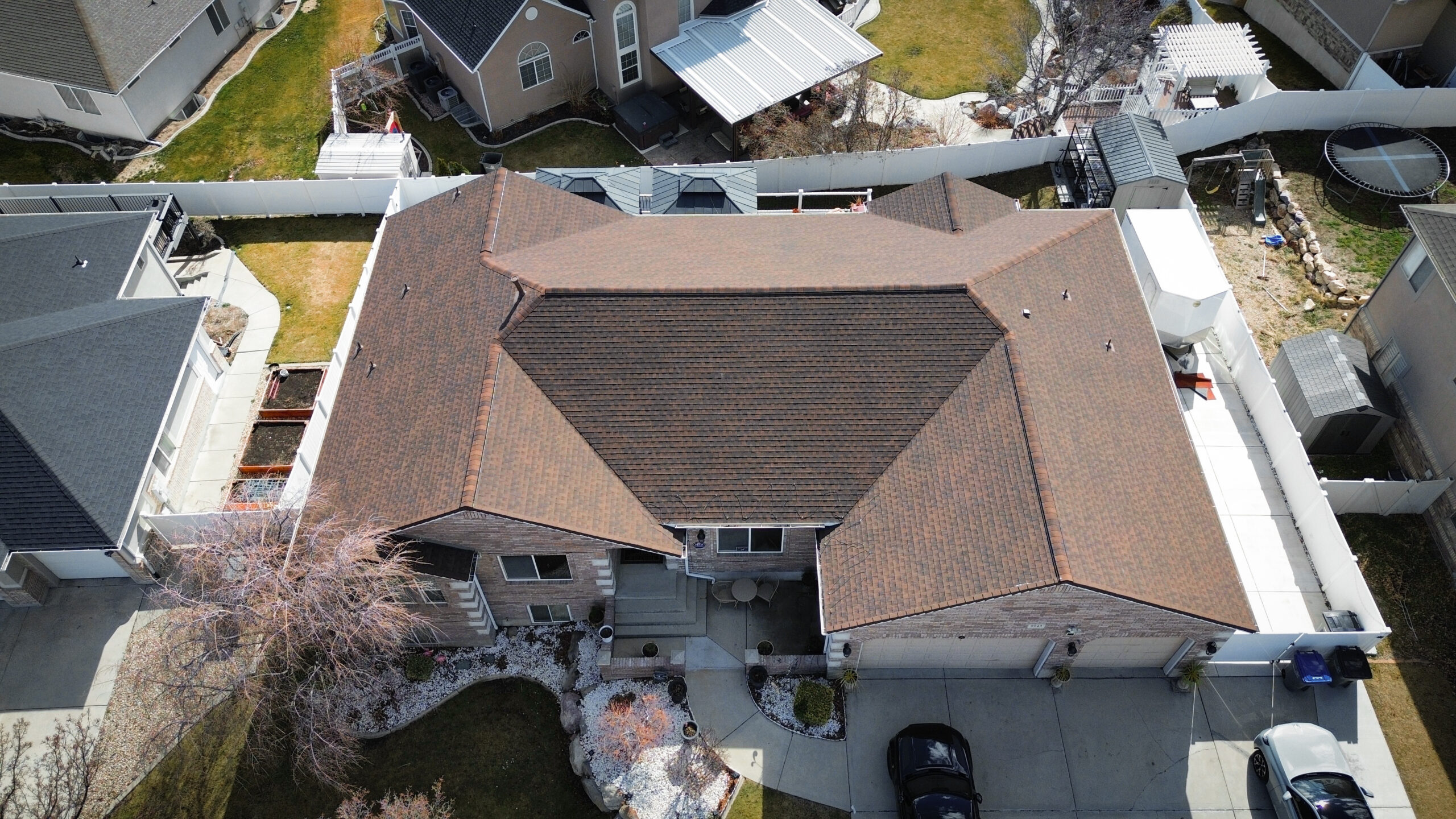Roofing Contractor examining roof ventilation and shingle wear on a Saratoga Springs - UT home