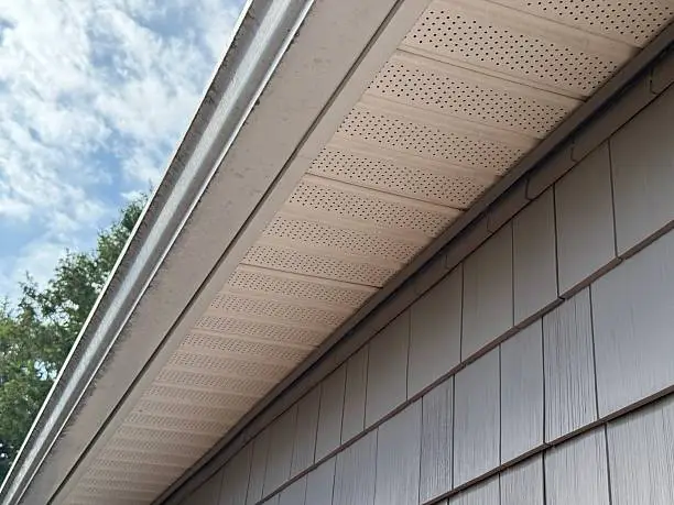 Soffit and Fascia Replacement in West Jordan - UT underway as a crew secures new eave trim, Soffit and Fascia Replacement in Sandy - UT in progress as installers secure new vented panels, Installer performing Soffit and Fascia Replacement on a two-story home in South Jordan - UT, Soffit and Fascia Replacement in Lehi - UT underway as a crew aligns new trim beneath eaves